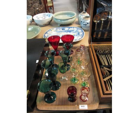 Tray of various drinking vessels to include green wine glasses, 19th Century ruby foliate liquor glasses, other liquor glasse