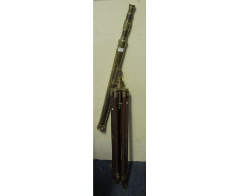 Modern brass telescope on adjustable wood and brass tripod.