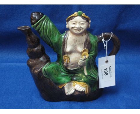 Chinese Majolica type pottery flask or rice wine pot in the form of a laughing man with out-stretched arm. CONDITION REPORT: 