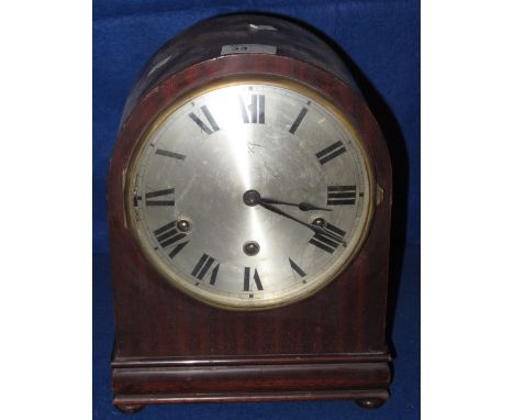 Early 20th Century mahogany cased three train mantel clock with silvered face.