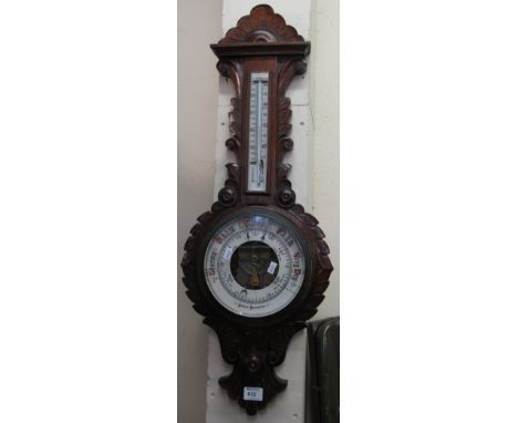 Early 20th century stained and carved wheel aneroid barometer.