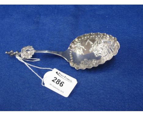 Dutch silver fancy caddy type spoon with repousse decoration.