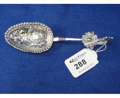 Dutch silver repousse decorated caddy type spoon with milkmaid and cow decoration. CONDITION REPORT: No obvious damage.