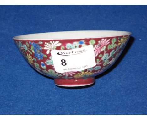 Small Chinese porcelain tea bowl overall decorated in coloured enamels with chrysanthemums and flower heads.  Square undergla