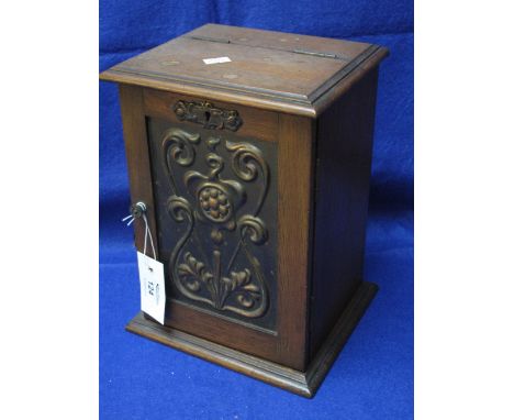 Early 20th Century oak smoker's cabinet with repousse oxidised copper Art Nouveau design panel to the door and fitted interio