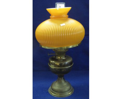 Brass double burner oil lamp with over-lay glass orange fluted shade and clear chimney.