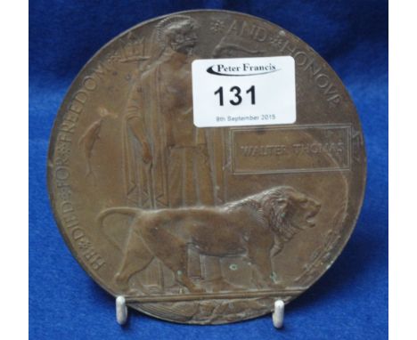 First World War bronze death penny or plaque awarded to the family of 'Walter Thomas'.