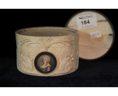 19th Century carved ivory cylindrical box and cover with carved and moulded decoration and painted portrait panel depicting M