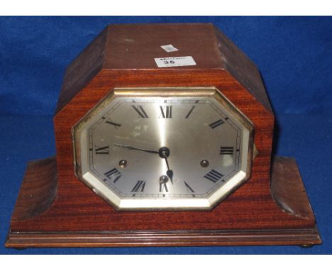 Mid 20th Century mahogany cased three train mantel clock with octagonal silvered face.