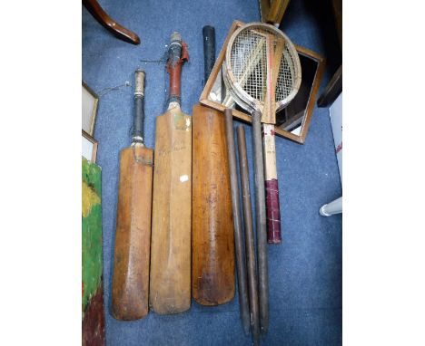 A COLLECTION OF THREE VINTAGE CRICKET BATS and a  tennis racquet