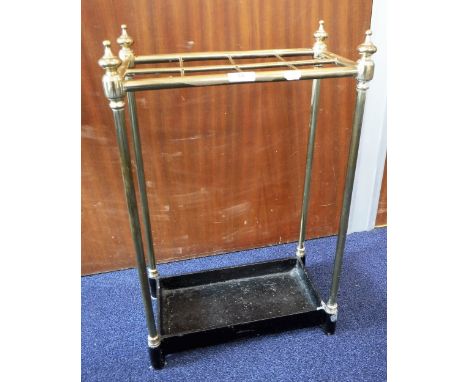 A VICTORIAN CAST-IRON AND BRASS STICK AND UMBRELLA STAND, 62cms high x 40 cms wide