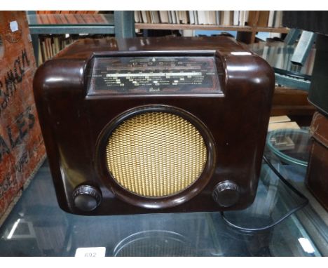 A VINTAGE BUSH RADIO, TYPE DAC.90.A. in brown Bakelite case