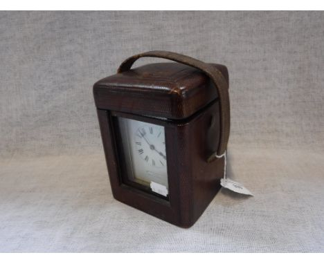 A LATE VICTORIAN BRASS-CASED CARRIAGE CLOCK with repeater, the white dial inscribed, "Jas Shoolbred & Co London Made in Franc