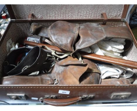 A COLLECTION OF VINTAGE MILIARIA, to include leather belts, and sundries contained in a brown suitcase