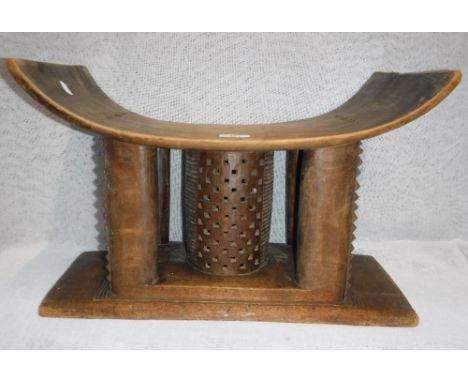 AN AFRICAN ASHANTI TRIBAL STOOL, 51 cm wide