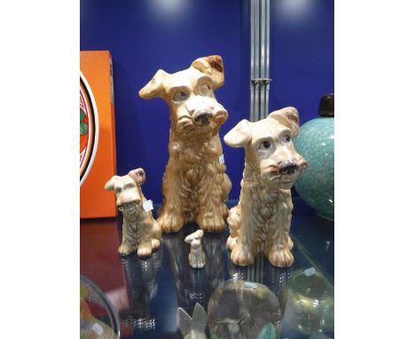 A LARGE SYLVAC TERRIER (1380) 28.5 cm high and three smaller examples graduating in size (4)
