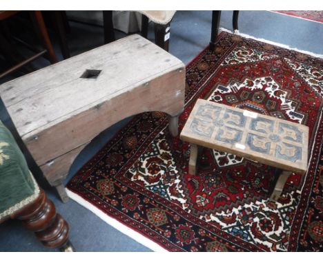 A 19TH CENTURY ELM STOOL and a small carved stool