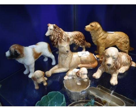 A SYLVAC SPANIEL (114) 18 cm long and a collection of similar Sylvac dogs (7)