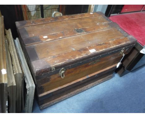 AN EARLY 20TH CENTURY METAL BOUND TRUNK, with label, "The Marshall Improved Air & Water Tight Trunk  1917", 77 cm wide