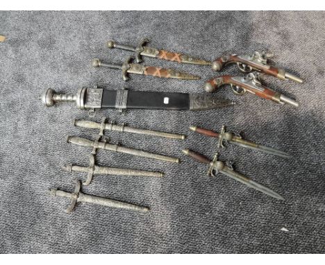 A collection of reproduction Daggers and Flintlock Pistols, Roman Short Sword with scabbard, two King Arthur Daggers, two Egy