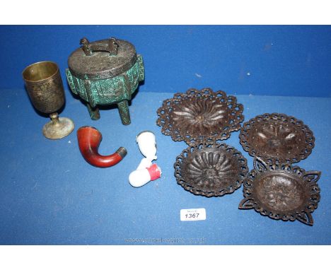 A quantity of miscellanea including small metal plaques, lidded three legged pot, goblet, wooden and ceramic pipe ends, a/f