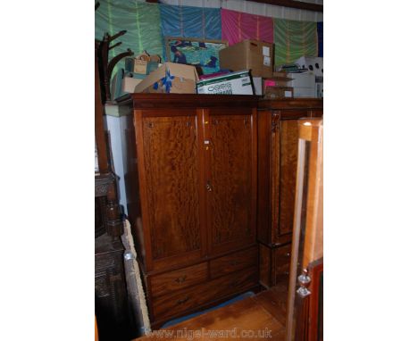 An Edwardian Mahogany Georgian style double door Wardrobe with cornice over opposing pair of moulded single panel doors openi