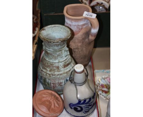 An earthenware jug, Goebel stoneware bottle, ethnic pot and two terracotta Plaques.