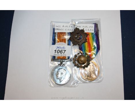 A WWI pair of War and Victory Medals to a Canadian No 1422, a CPL  J D. Brown, C.A.S.C. cap badge and a button sweetheart Bro