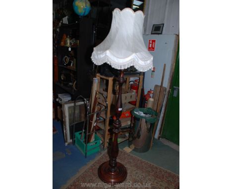 A Bulbously turned Victorian style mahogany Standard Lamp and silk tasselled Shade