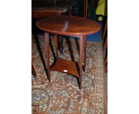 An Edwardian Mahogany oval top Occasional Table with cross-banded edge, on tapering square legs with strung lower shelf stret