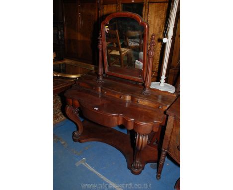 A Victorian Mahogany Duchess Dressing Table with shaped mirror in fluted supports on shaped shelf having three shaped front j