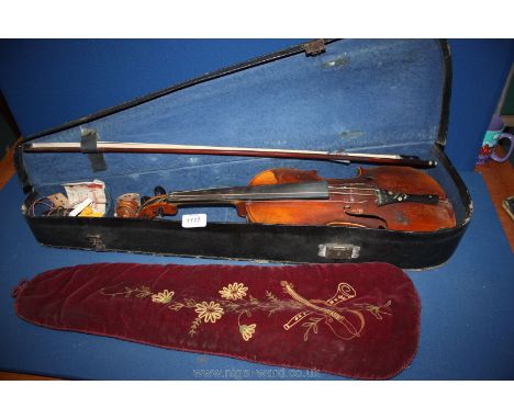 A Violin labelled 'Antonius Stradivarius Cremonensis'  with Mother of Pearl inlay, together with bow in case.