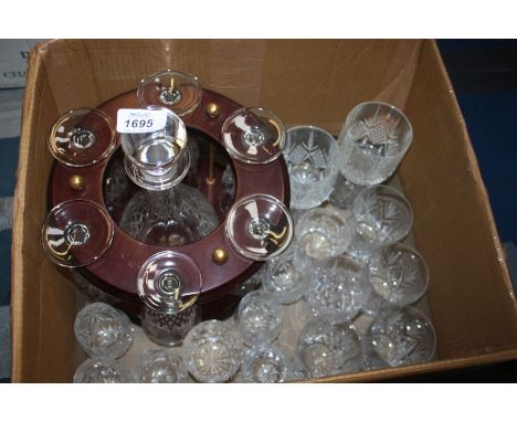 A Decanter and glasses on a stand (one odd glass) and various other cut glasses, tumblers, etc.