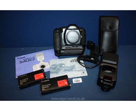 A Canon EOS 1 35mm Auto focus SLR Camera with instructions, grip together with a Canon Speedlite 540EZ flash gun with case an