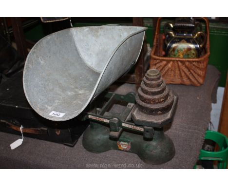 A Carnegie & Layton 14 lbs weighing Scales and weights