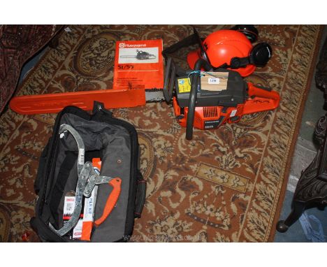 A Husqvarna 55 petrol-engined Chainsaw having 16" cutter-bar, together with a bag containing a chainsaw safety helmet, variou