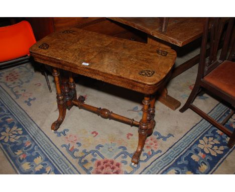 A good burr Walnut and inlay top revolving fold over Card Table with purple baize lined interior, on four turned supports, jo