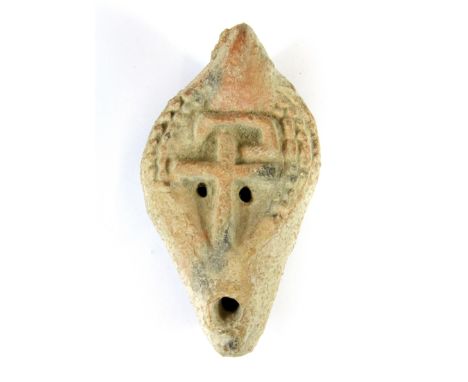 A Roman North African redware oil lamp, circa 4th -5th Century, H. 11cm. (Prov. Samy collection)