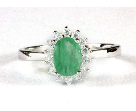 A 925 silver emerald and cubic zirconia set cluster ring, (N.5).