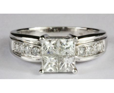 An 18ct white gold princess cut diamond set cluster ring with brilliant cut diamond set shoulders, approx. 1ct overall, (P.5)