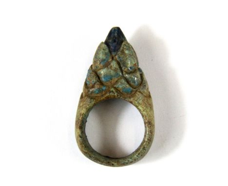 An early Egyptian turquoise glazed pottery ring. (Prov. Samy collection).