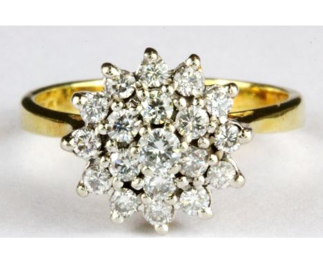 An 18ct yellow gold diamond set cluster ring, (M).