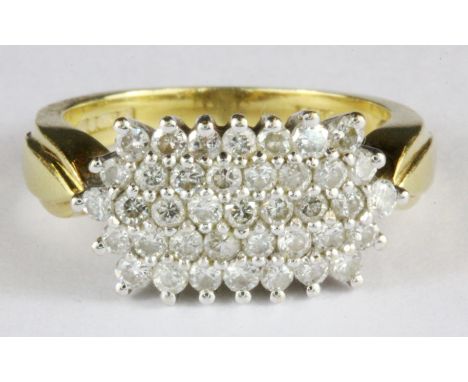 An 18ct yellow gold diamond set cluster ring, (I.5).