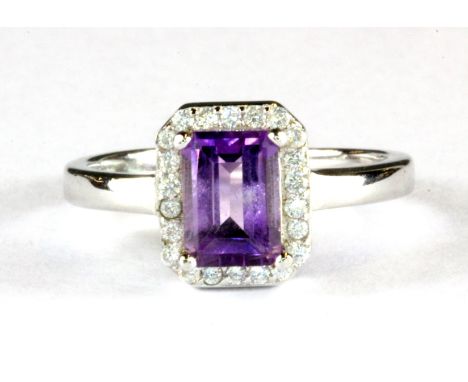 A 925 silver amethyst and white stone set cluster ring, (L).