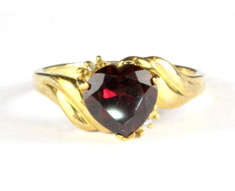 A 9ct yellow gold heart cut garnet and diamond set ring, (O).