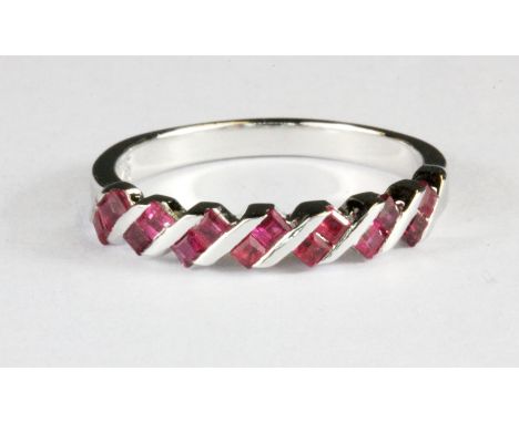 A 925 silver ruby set half eternity ring, (L.5).
