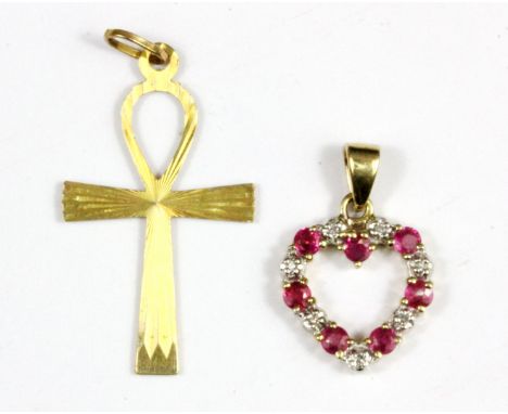 A 9ct yellow gold Ankh pendant and a 9ct gold ruby and diamond set heart shaped pendant.