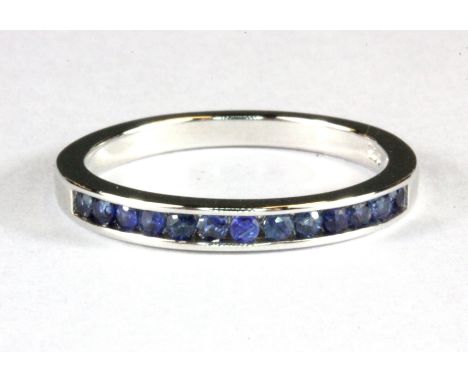 A 925 silver sapphire set half eternity ring, (N.5).
