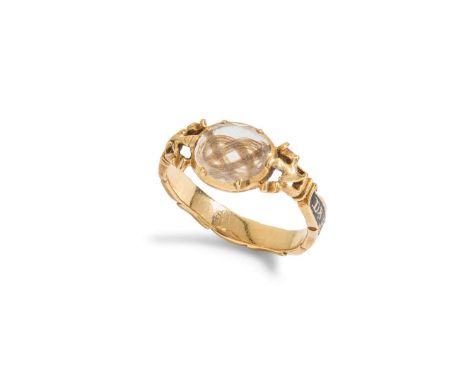  A MID 18TH CENTURY MOURNING RING  the facetted rock-crystal encasing braided hair detail, the band of scalloped outline with