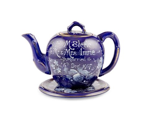  SCOTTISH POTTERY TEAPOT ON STAND DATED 1907 PROBABLY UNMARKED WEMYSS WARE glazed in mazarine blue, with rustic handle and sp